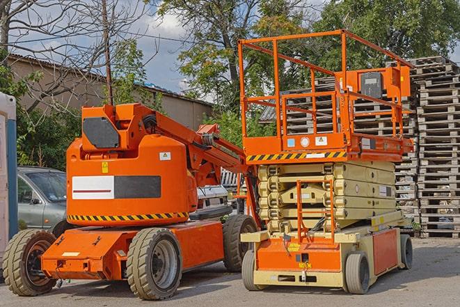 forklift operator transporting materials in warehouse in East Brunswick NJ